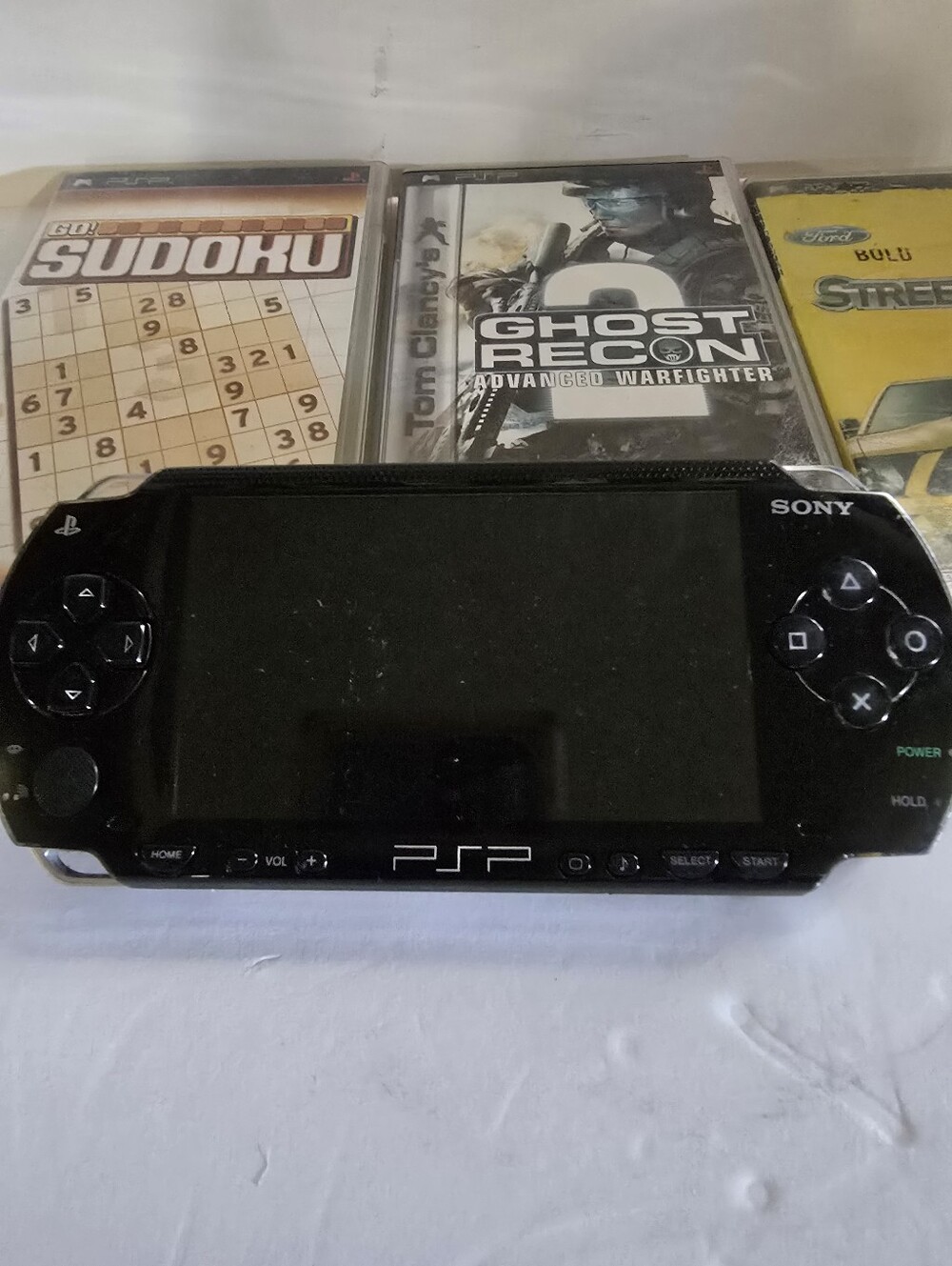 Sony Black PSP Handheld Game Console with Screen And 3 Games, Untested